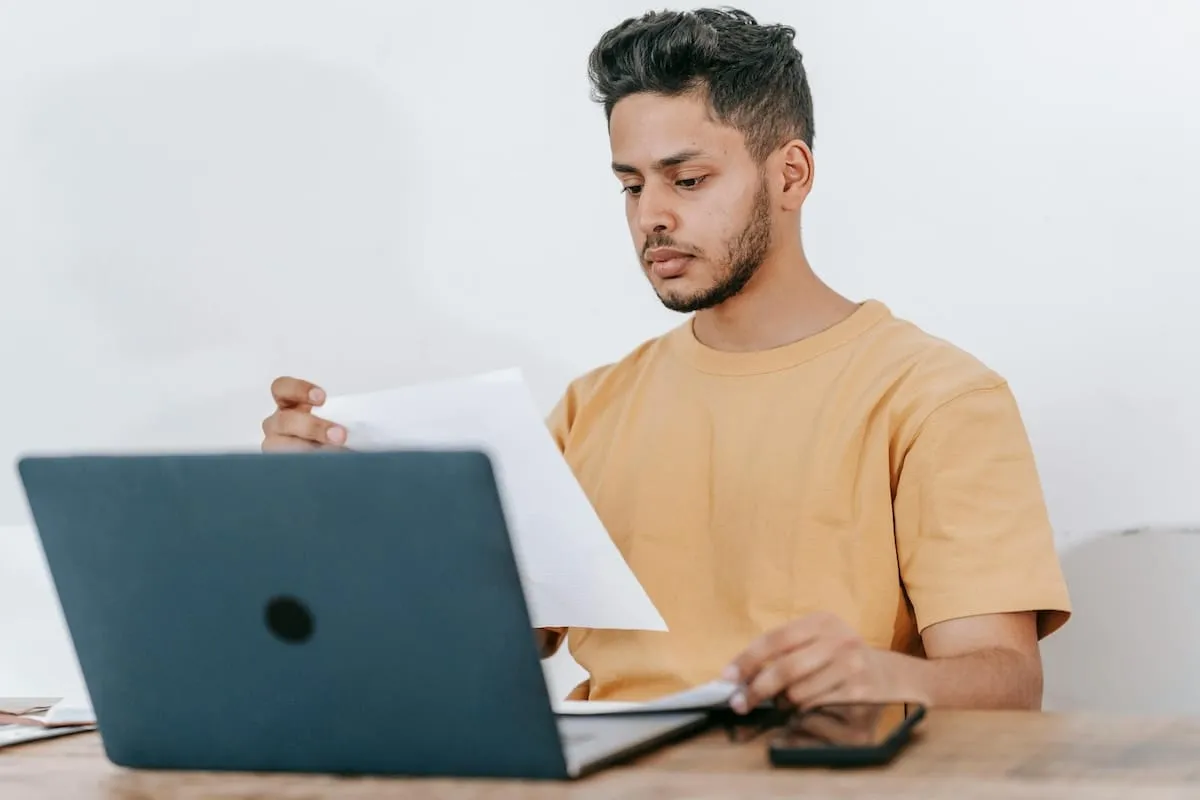 Guy sitting in front of laptop