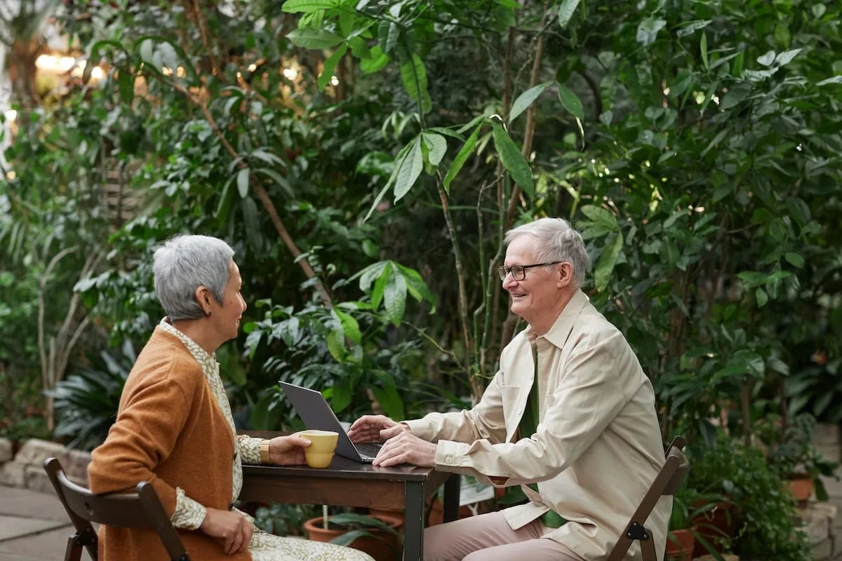 Older couple sitting on table